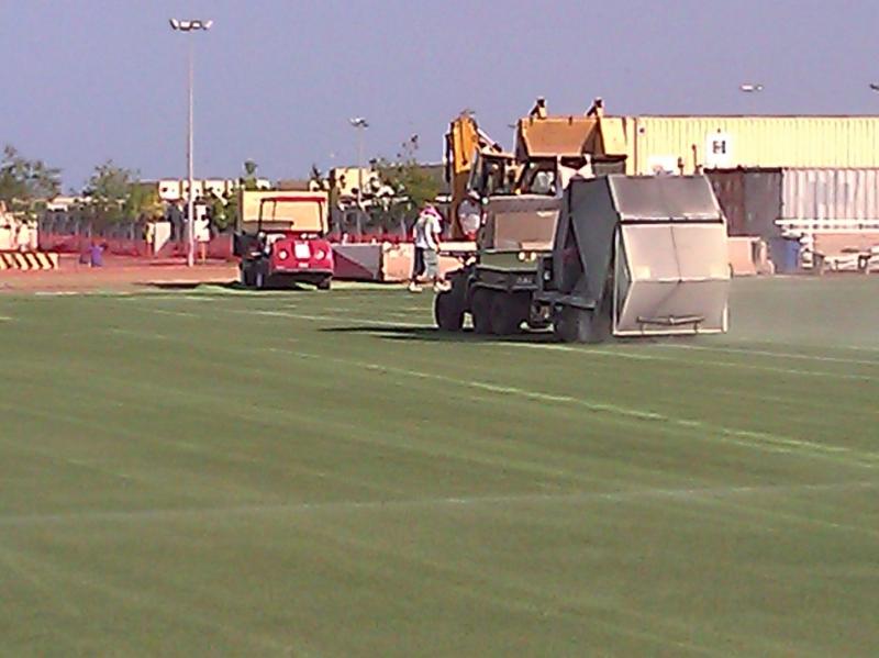 Cleaning and grooming turf at Camp Lemonier, Djibouti, Africa.