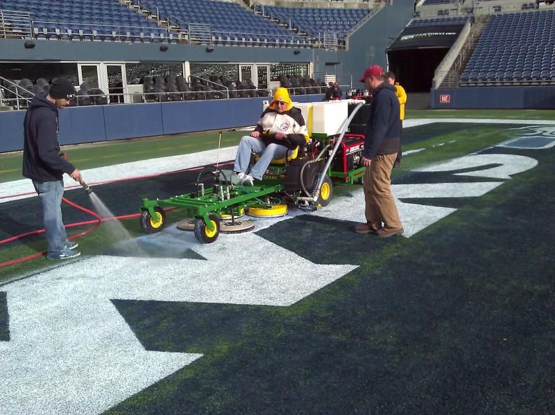 Paint removal in an endzone of the Seattle Seahawks turf field.